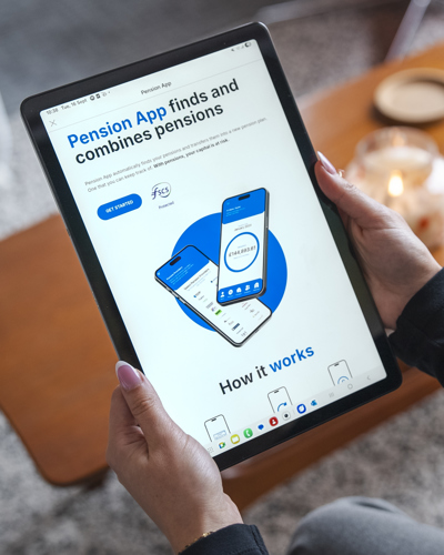 An image showing someone holding a tablet, displaying the Pension App homepage.